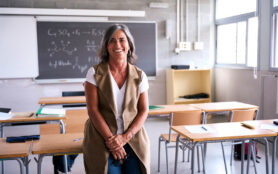 Portrait,Middle Aged,Female,High,School,Teacher,Looking,Smiling,At,Camera